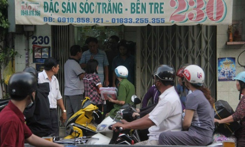 Người đàn bà bí ẩn chụp ảnh sát thủ bắn chết chủ tiệm Sài Gòn