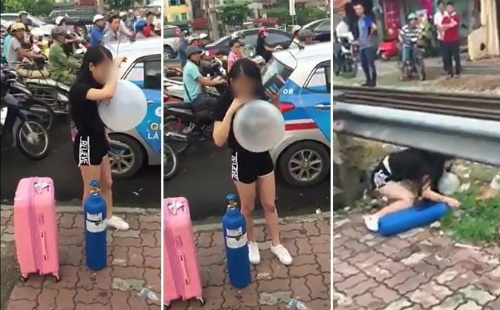 Thiếu nữ xách bình khí cười ra hít bóng trên phố Hà Nội